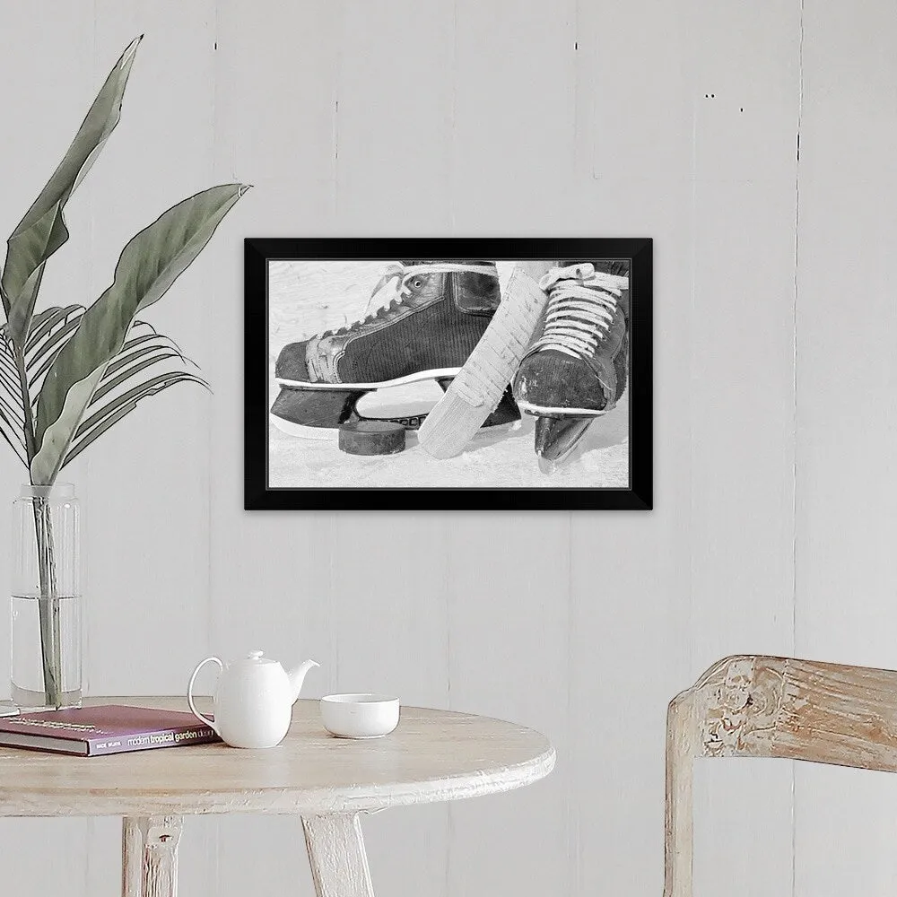 "Hockey skates and puck" Black Framed Print