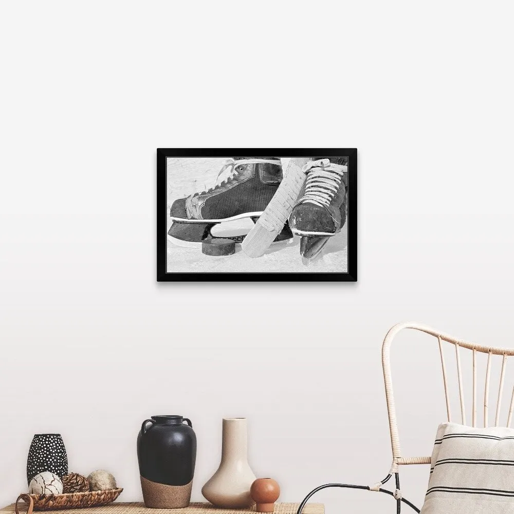 "Hockey skates and puck" Black Framed Print