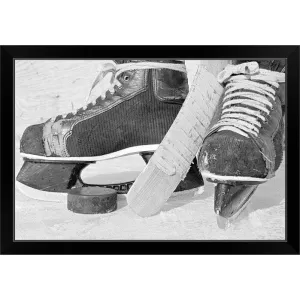 "Hockey skates and puck" Black Framed Print